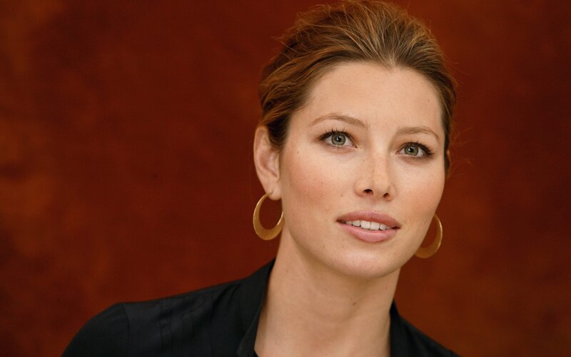 woman with gold hoop earrings