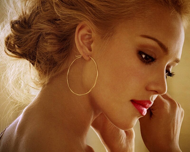woman with gold hoop earrings