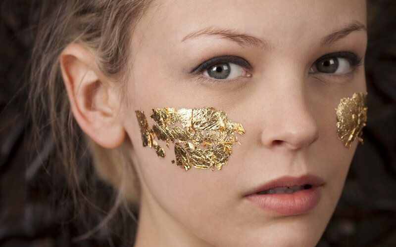 woman with gold leaf on face