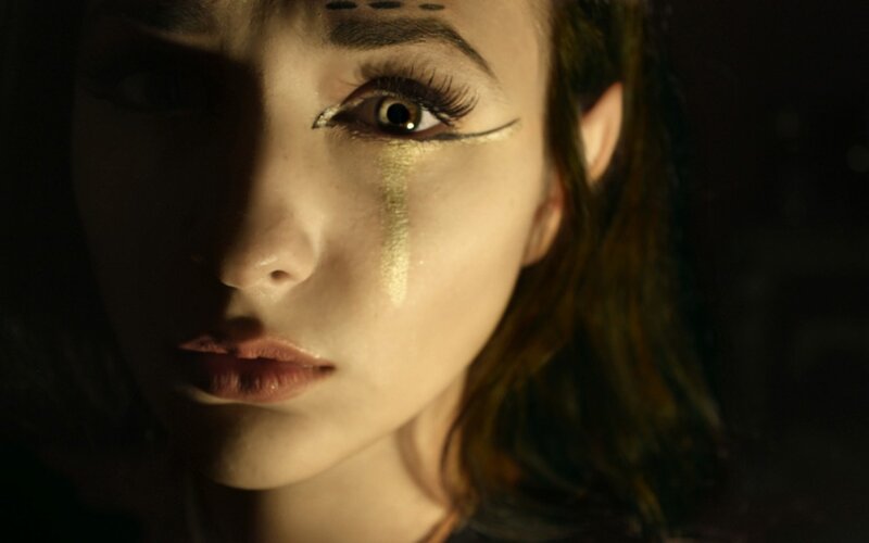 woman with gold makeup