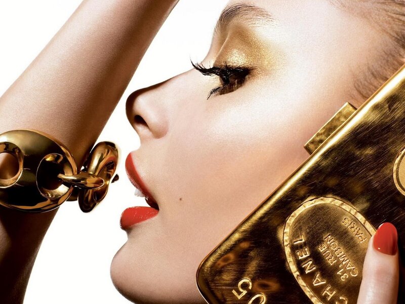 woman with gold makeup and accessories