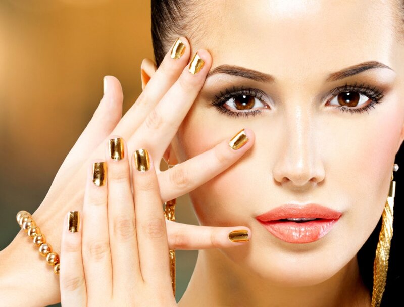 Woman with Gold Nails