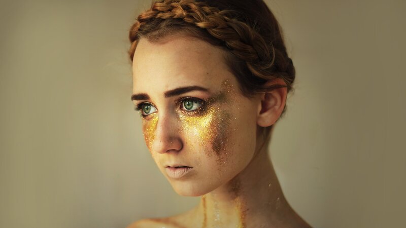 woman with golden makeup