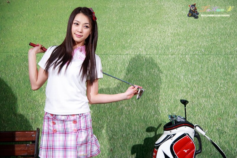 Woman with golf clubs