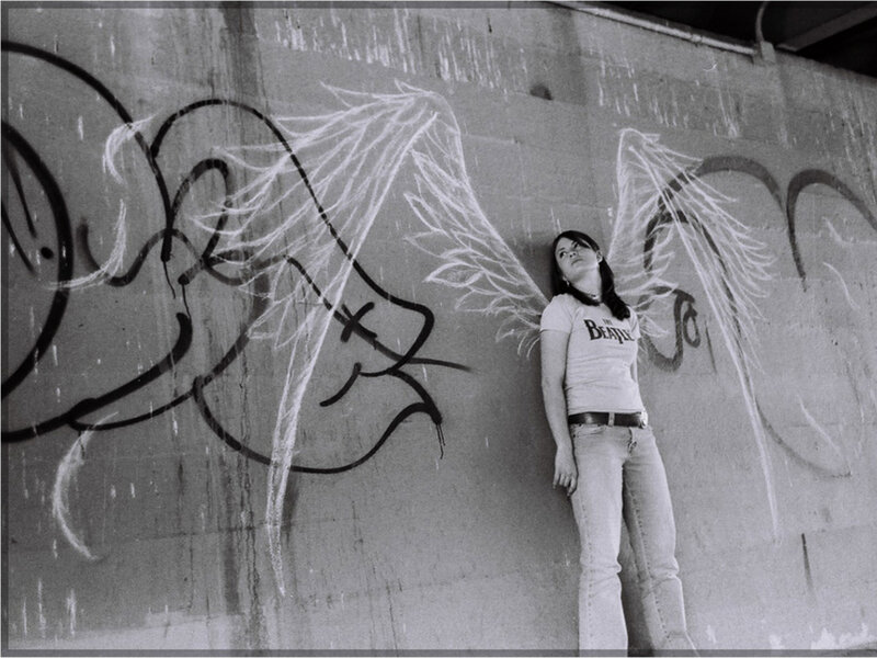 woman with graffiti wings