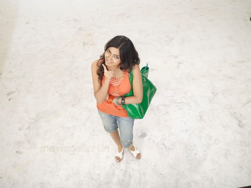 woman with green bag smiling