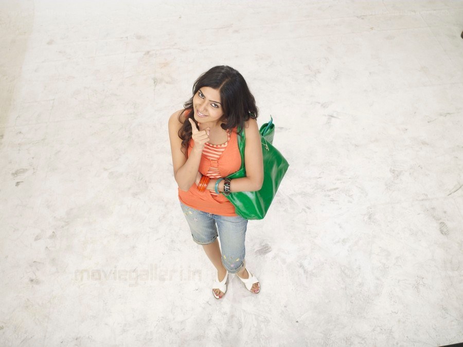 woman with green bag smiling