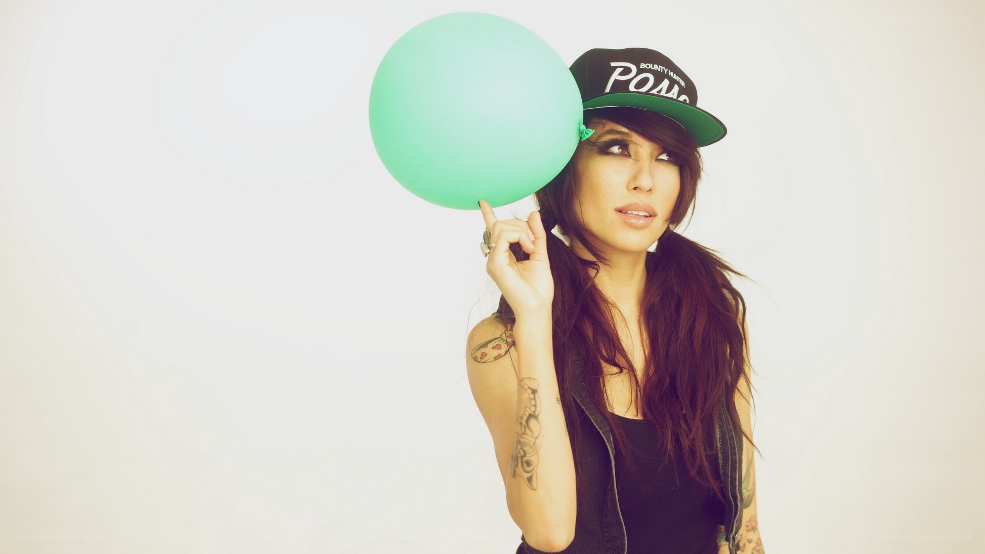 woman with green balloon
