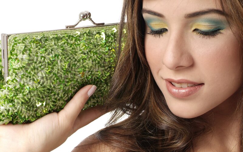 woman with green clutch purse