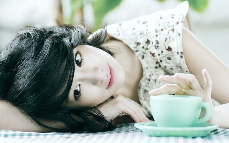 woman with green cup