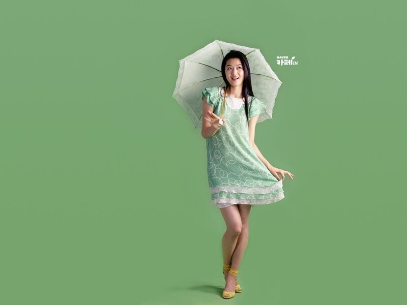 woman with green dress and umbrella