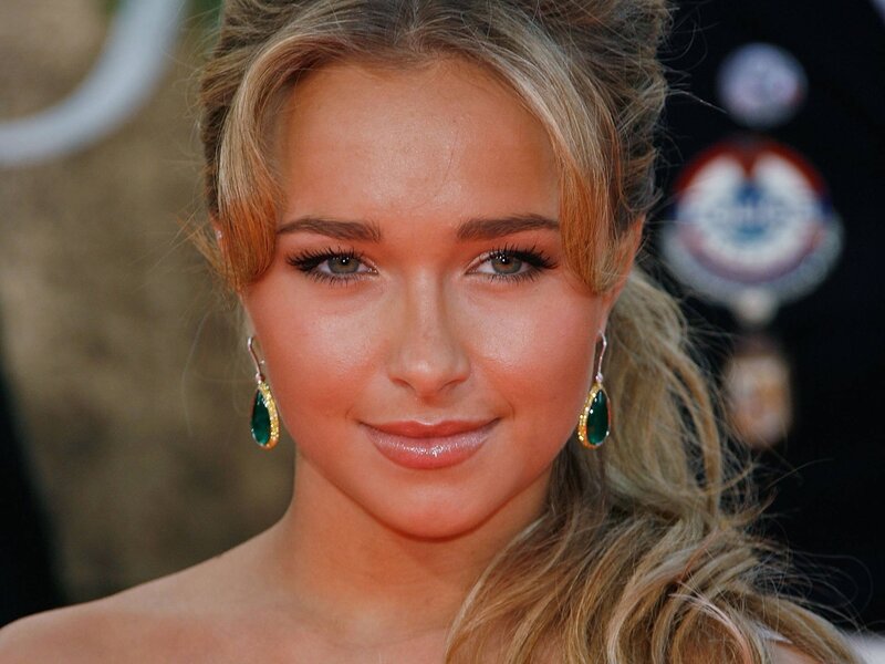 woman with green earrings