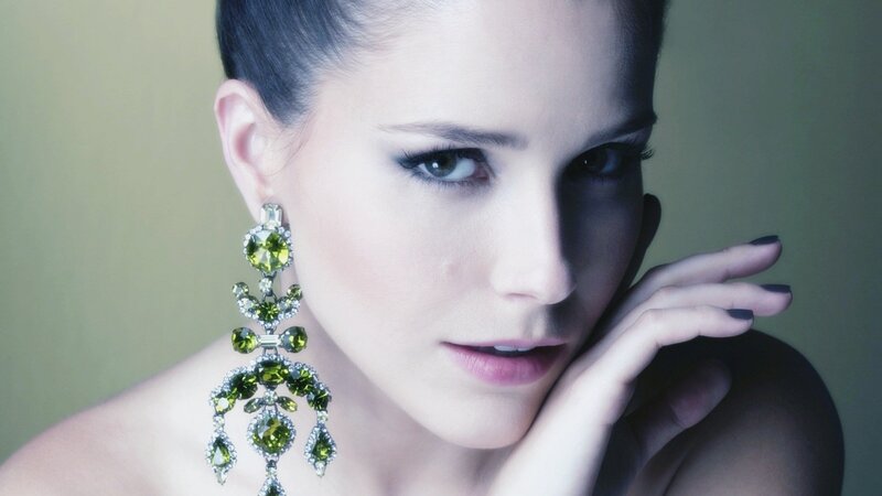 woman with green earrings