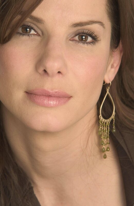 woman with green earrings