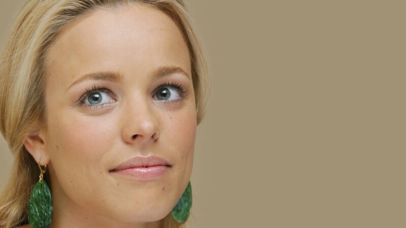 woman with green earrings