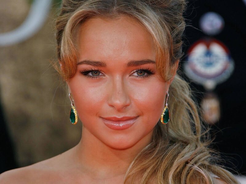 woman with green earrings