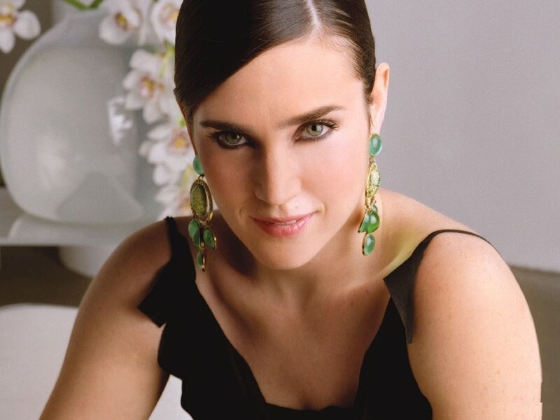 woman with green earrings
