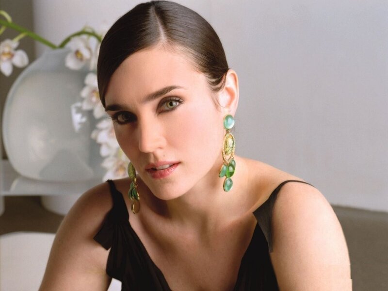 woman with green earrings
