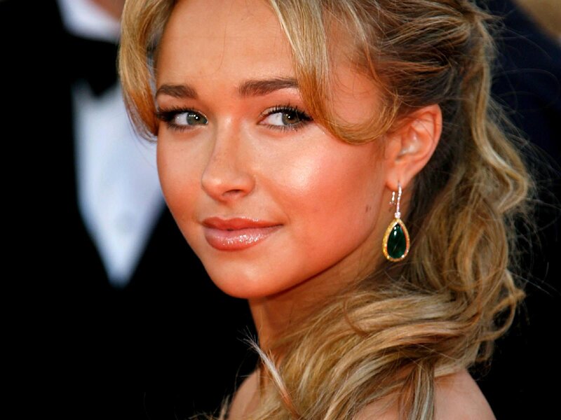 woman with green earrings