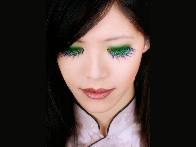 woman with green eye makeup