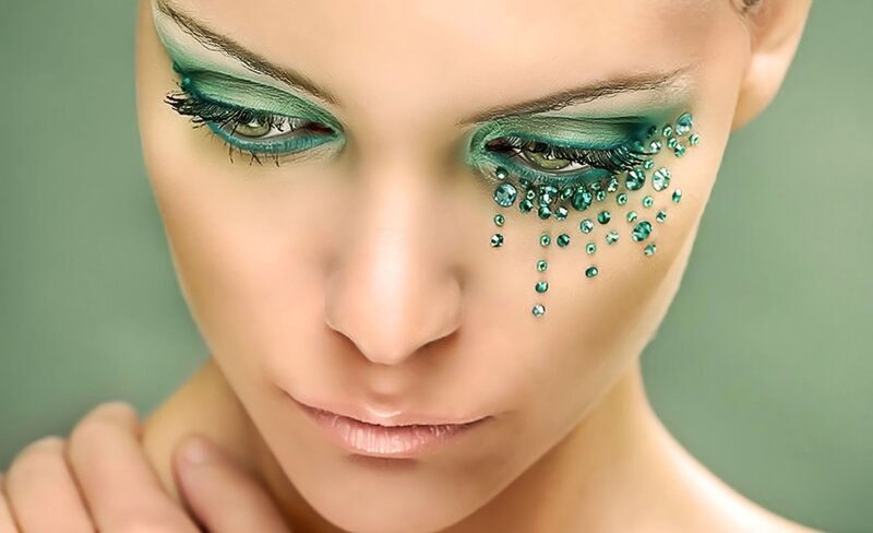 woman with green eye makeup