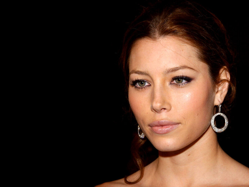 woman with green eyes and earrings