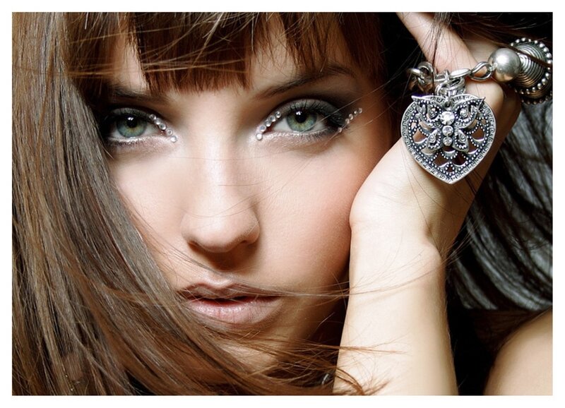 woman with green eyes and jewelry