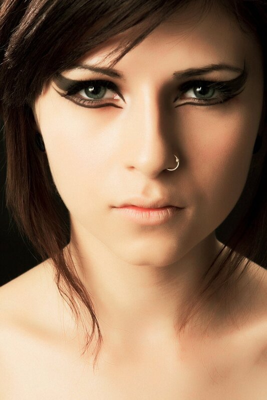 woman with green eyes and nose ring