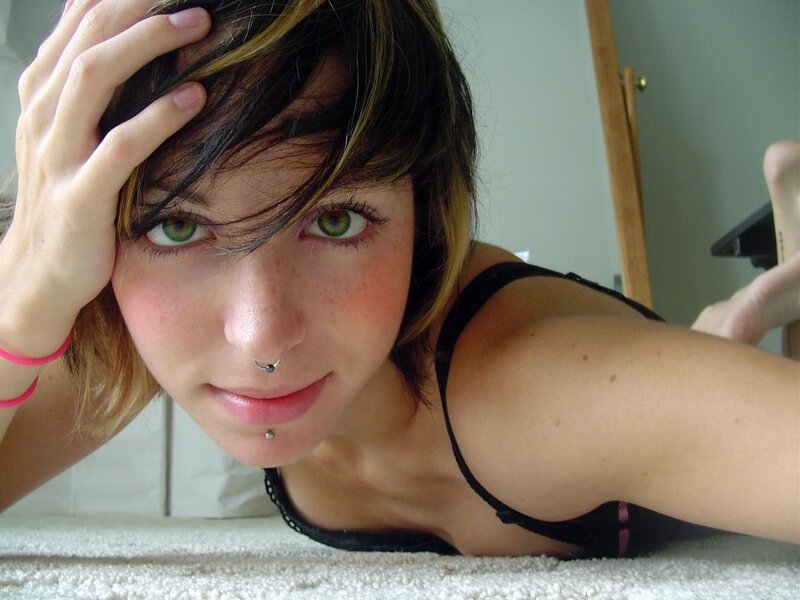 woman with green eyes and piercings