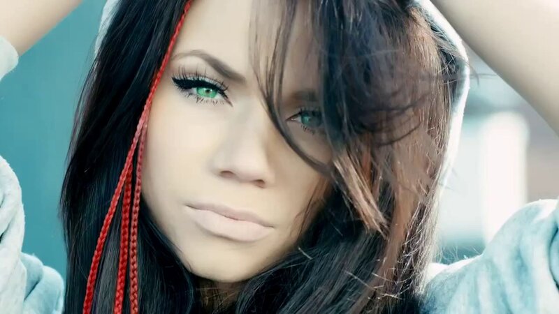 woman with green eyes and red braids