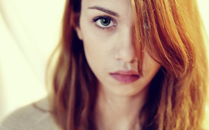 woman with green eyes and red hair
