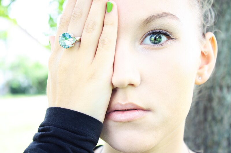 woman with green eyes and ring