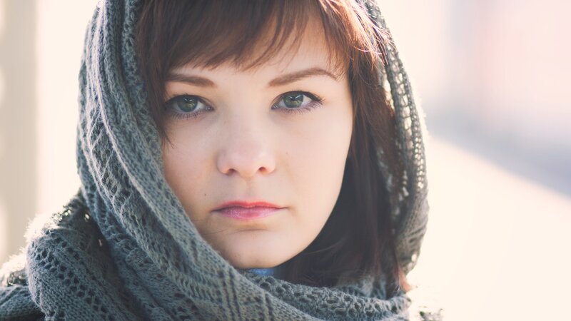 woman with green eyes and scarf