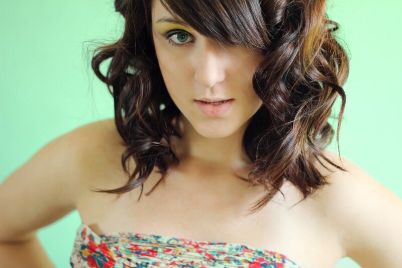 woman with green eyes and wavy hair