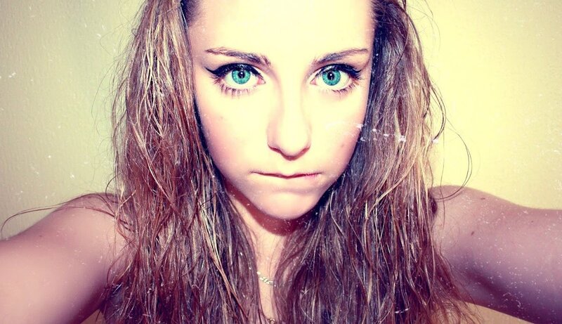 woman with green eyes and wet hair