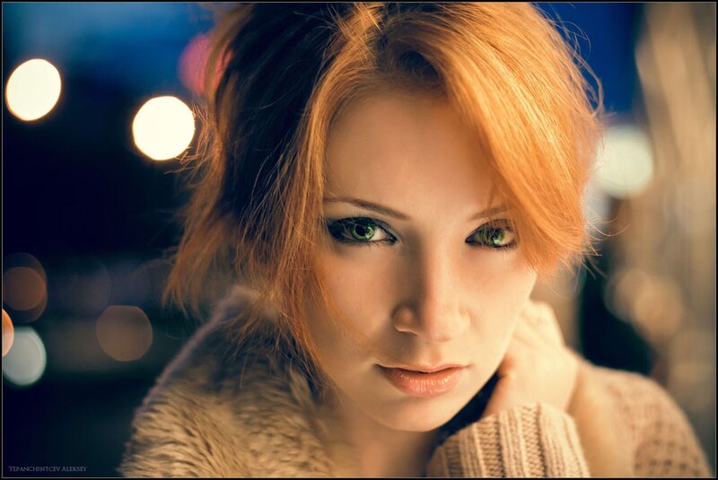 woman with green eyes at night