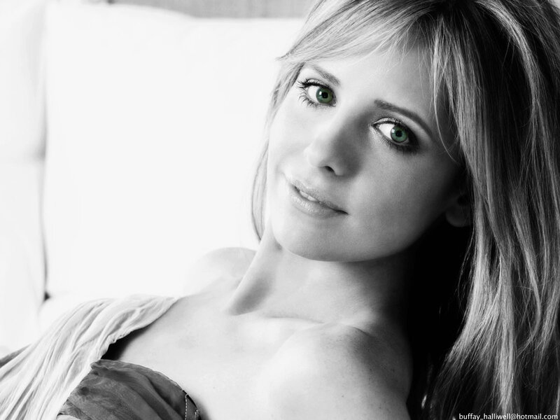 woman with green eyes in black and white