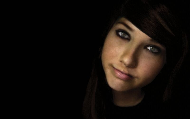 woman with green eyes in dark