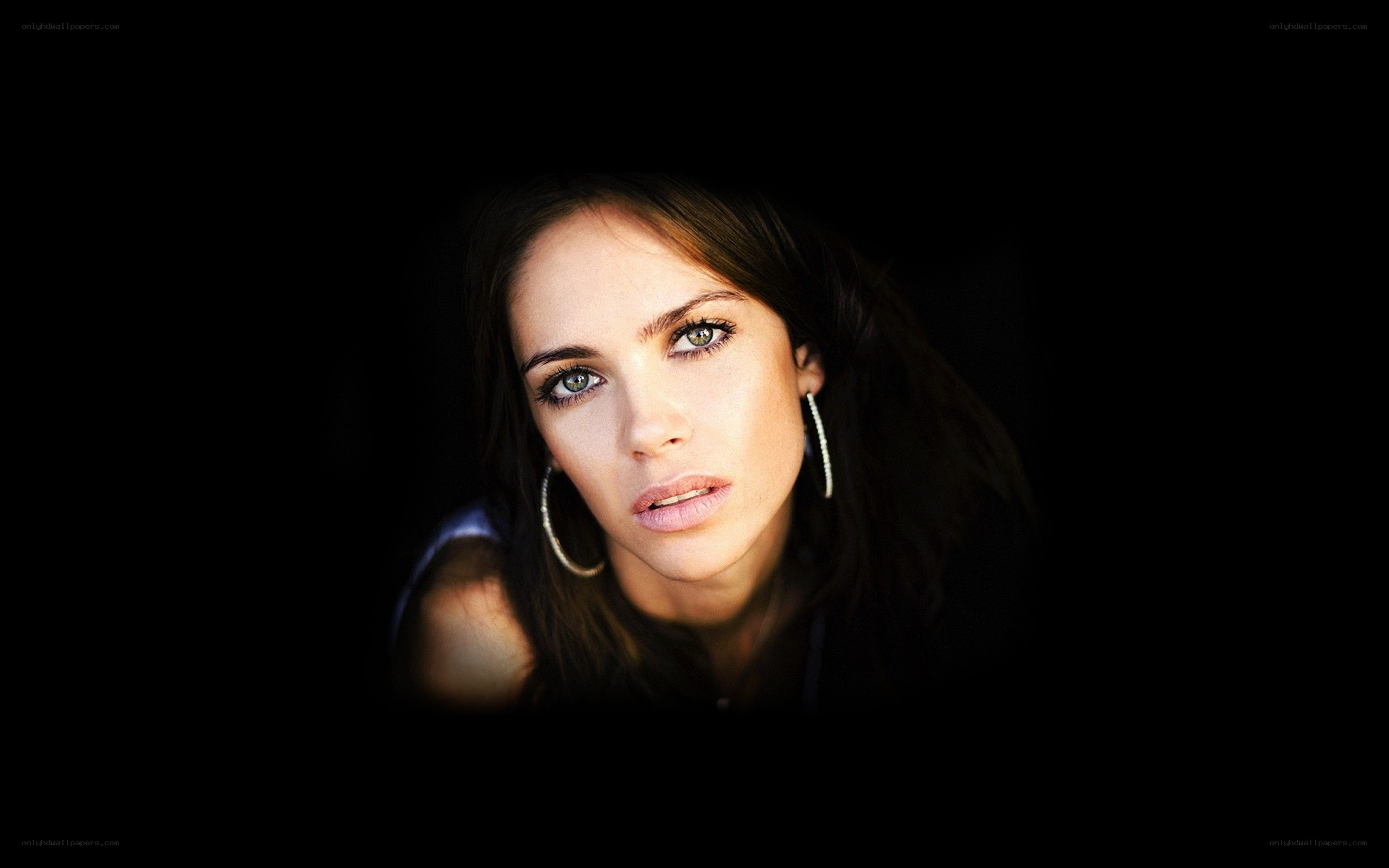 woman with green eyes in dark