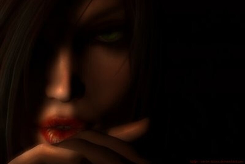 woman with green eyes in darkness