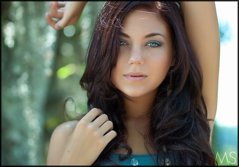 woman with green eyes in forest