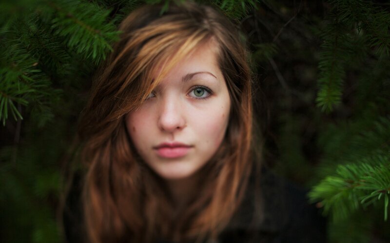 woman with green eyes in forest