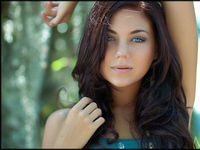 woman with green eyes in forest