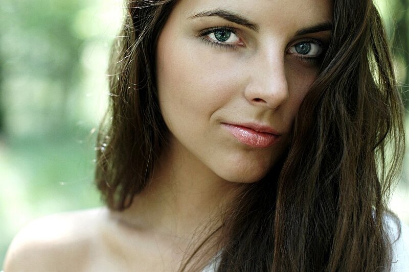 woman with green eyes in forest