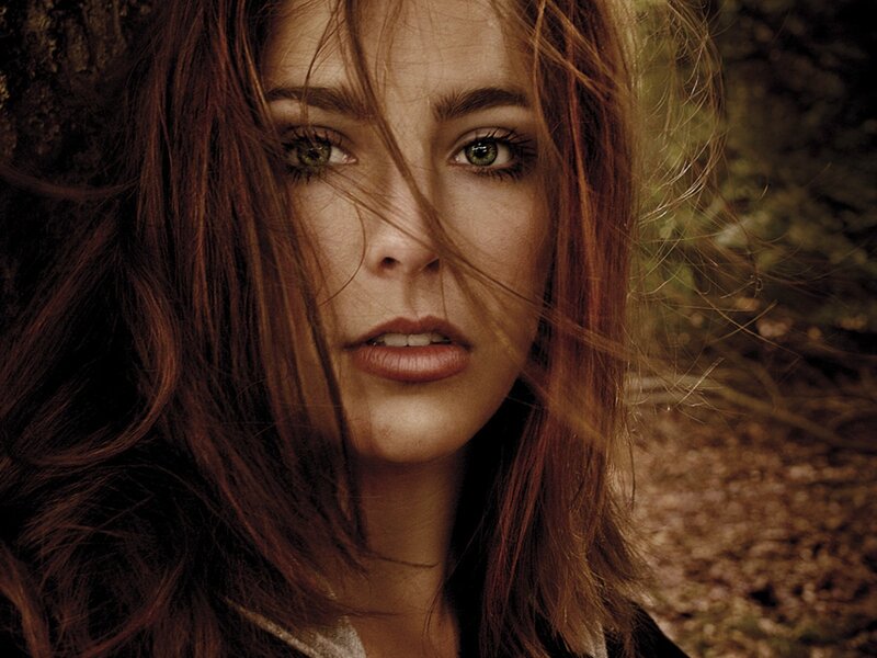 woman with green eyes in forest