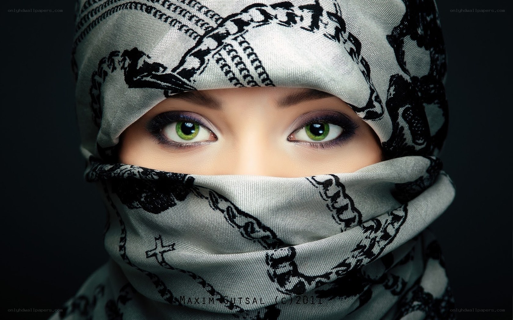 woman with green eyes in headscarf
