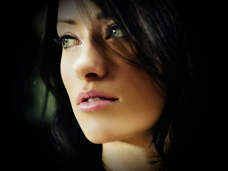 woman with green eyes in shadow