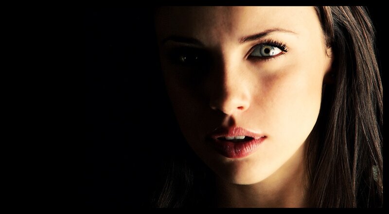 woman with green eyes in shadow