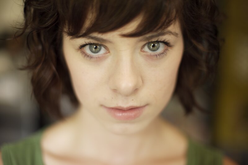 woman with green eyes looking at camera