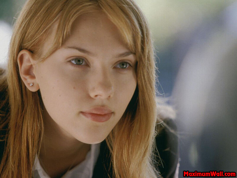 woman with green eyes looking down